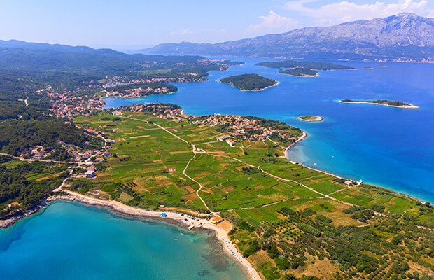 Photo of Lumbarda wineyards, sea and island.