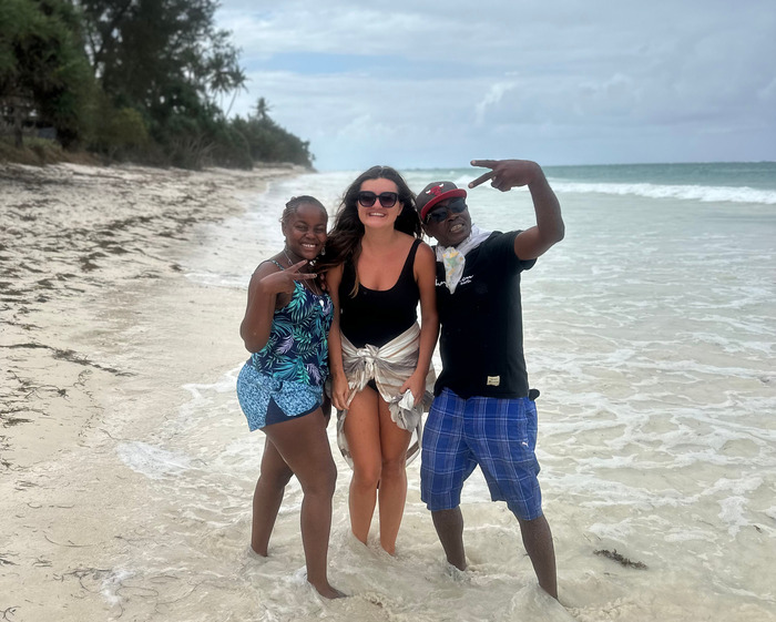 Ana with the beach boys in Kenya.