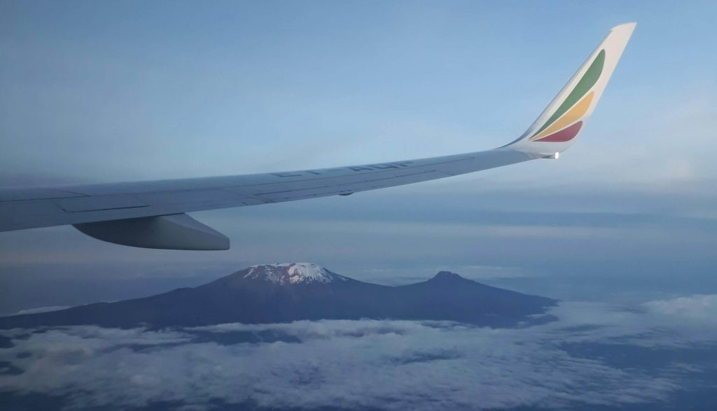 Plane wing and peak of Kilimanjaro in background.