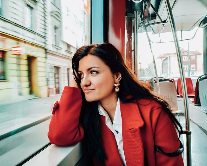 Ana in Prague metro looking out the window.