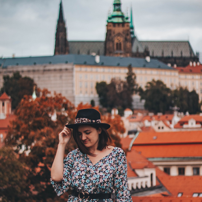 Ana with Prague Castle in blurry background.