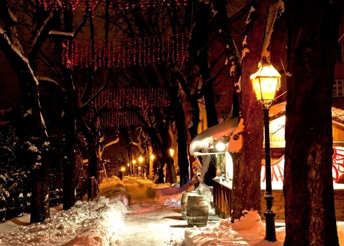 Upper town Shristmas stands in Zagreb covered in snow.